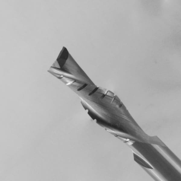 Multi-fluted twist drill bit with complex spiral cutting geometry and self-centering tip on metallic shank