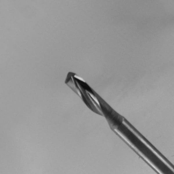 Metallic end mill or drill bit with helical spiral flutes and square tip on cylindrical shank